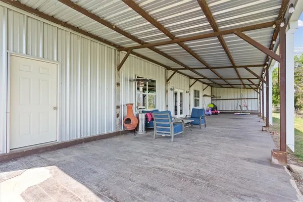 a view of a swimming pool with a patio