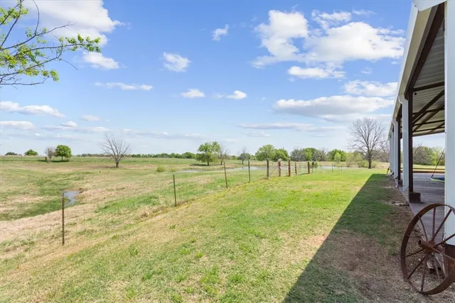 a house view with swimming pool and garden