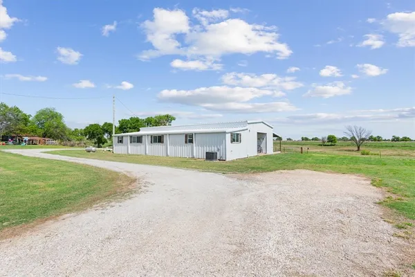 a view of house with outdoor space and street view