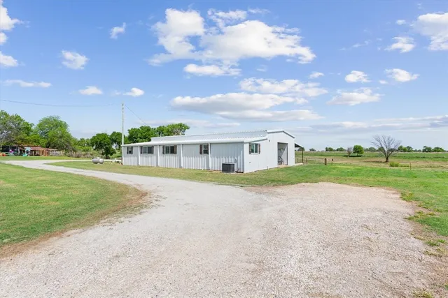 a view of house with outdoor space and street view
