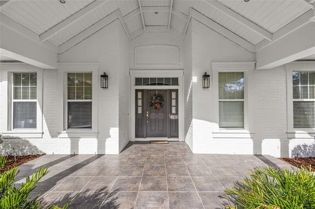 a kitchen with sink and cabinets
