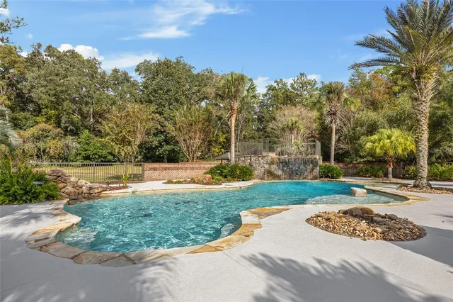 a view of a house with backyard porch and sitting area