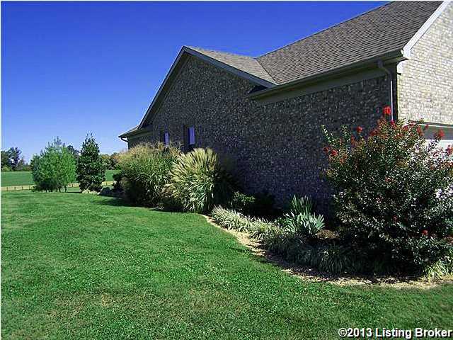 7062 Brunerstown Road Simpsonville, KY 40067 - Photo 29 of 30 Side landscaping.....the professional landscaping goes all the way around this home