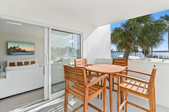 a dinning table and chairs in a room