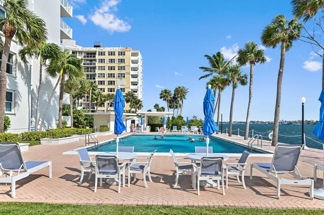 a view of a patio with a table and chairs