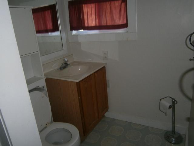 22 Brookshire Road Hyannis, MA 02601 - Photo 9 of 10 a bathroom with a toilet a sink and a mirror