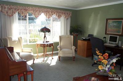 1090 Rutherford Road Rutherford, CA 94558 - Photo 4 of 10 a living room with furniture and a window