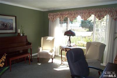 1090 Rutherford Road Rutherford, CA 94558 - Photo 5 of 10 a living room with furniture and a large window