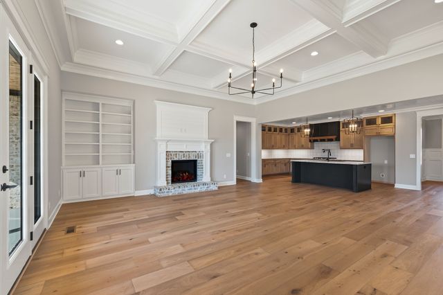 a view of a kitchen with a sink and dishwasher kitchen view with wooden floor