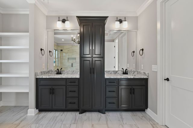 a bathroom with a double vanity sink and a mirror