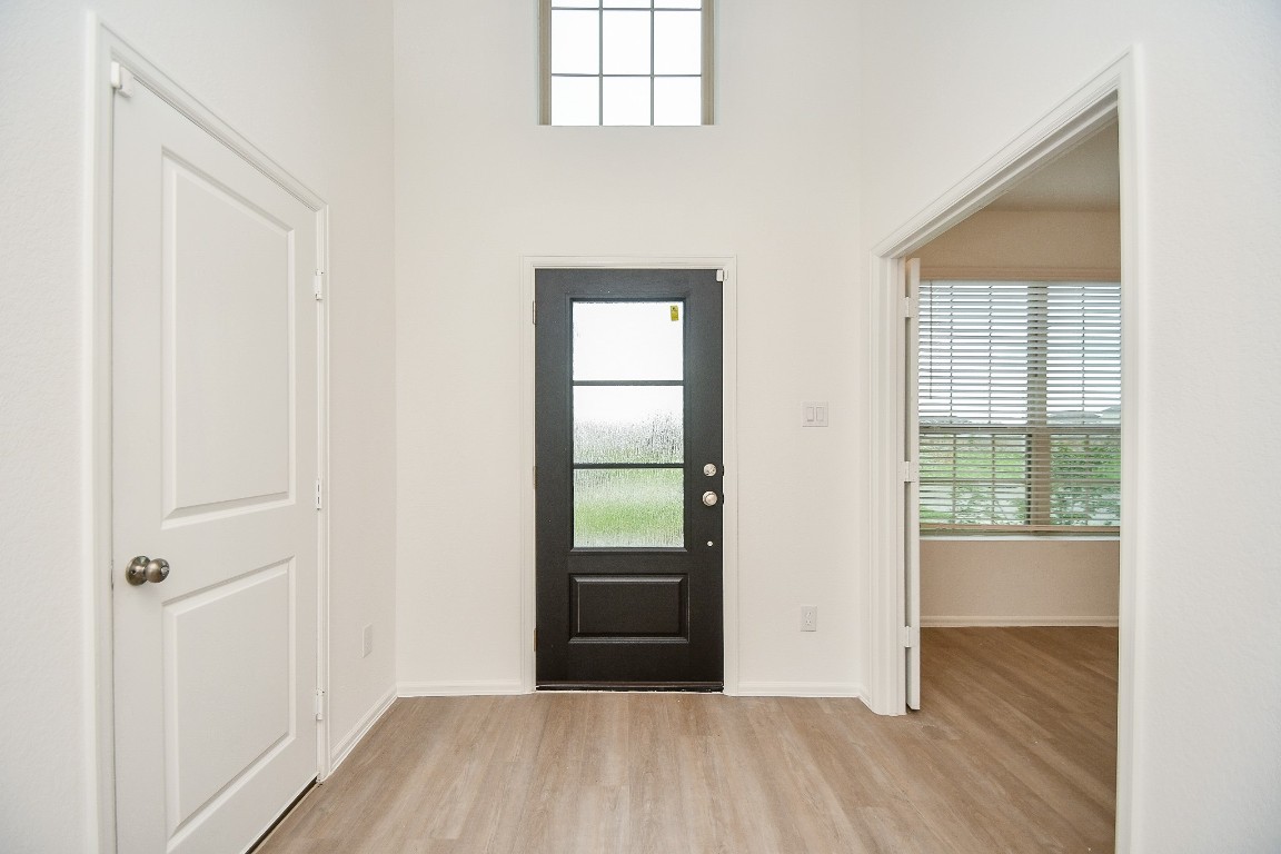 5240 Pine Pass Drive Rosenberg, TX 77469 - Photo 13 of 32 an empty room with wooden floor closet and windows