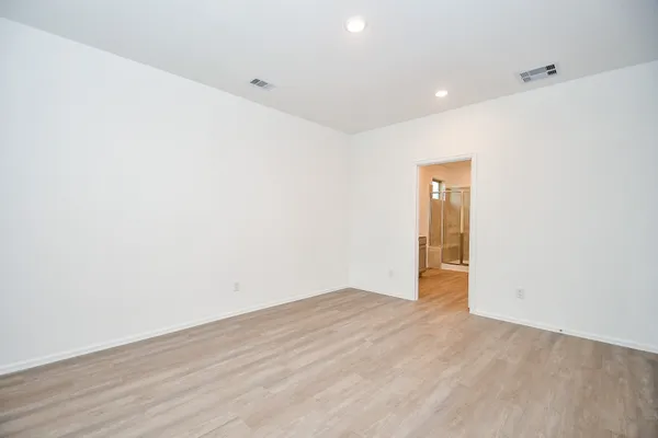 a bathroom with a shower sink and mirror