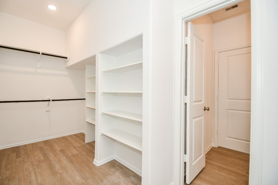 5240 Pine Pass Drive Rosenberg, TX 77469 - Photo 28 of 32 a view of walk in closet with empty racks