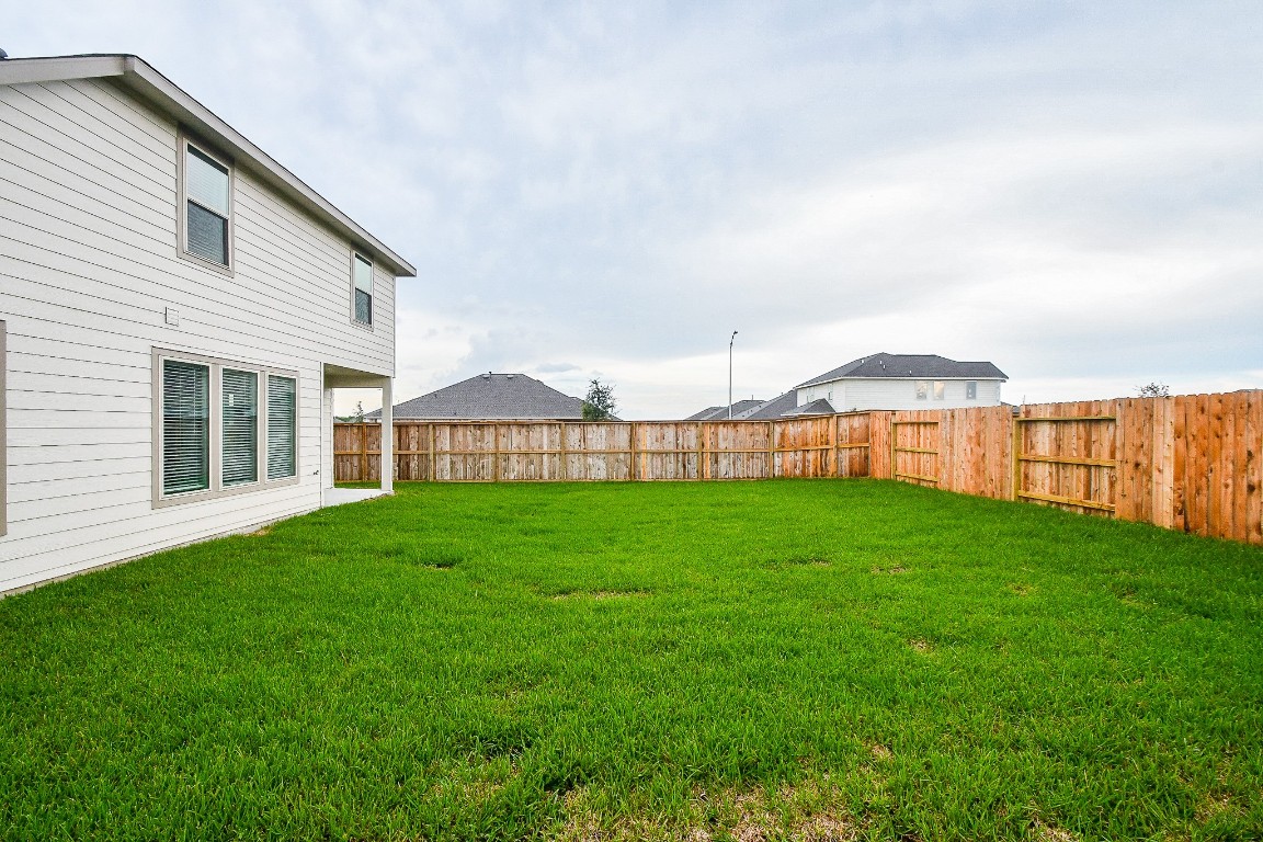 5240 Pine Pass Drive Rosenberg, TX 77469 - Photo 32 of 32 a view of a house with a big yard and large trees