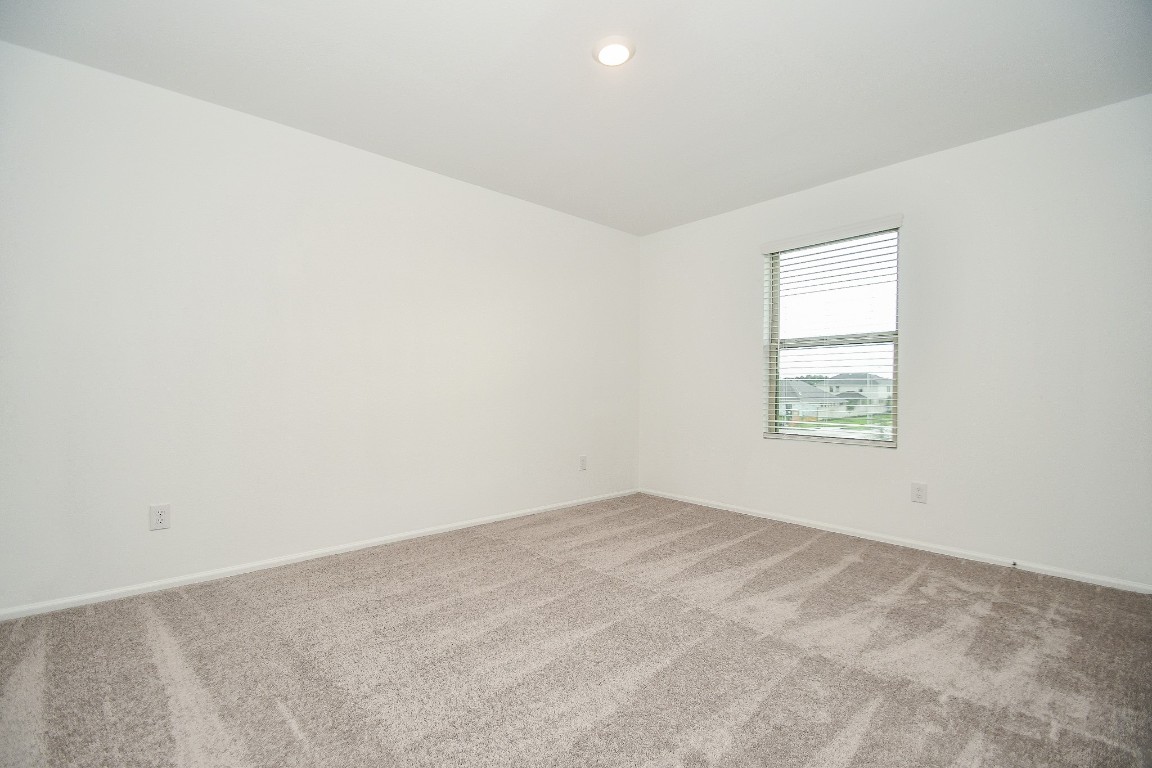 5240 Pine Pass Drive Rosenberg, TX 77469 - Photo 9 of 32 an empty room with a window