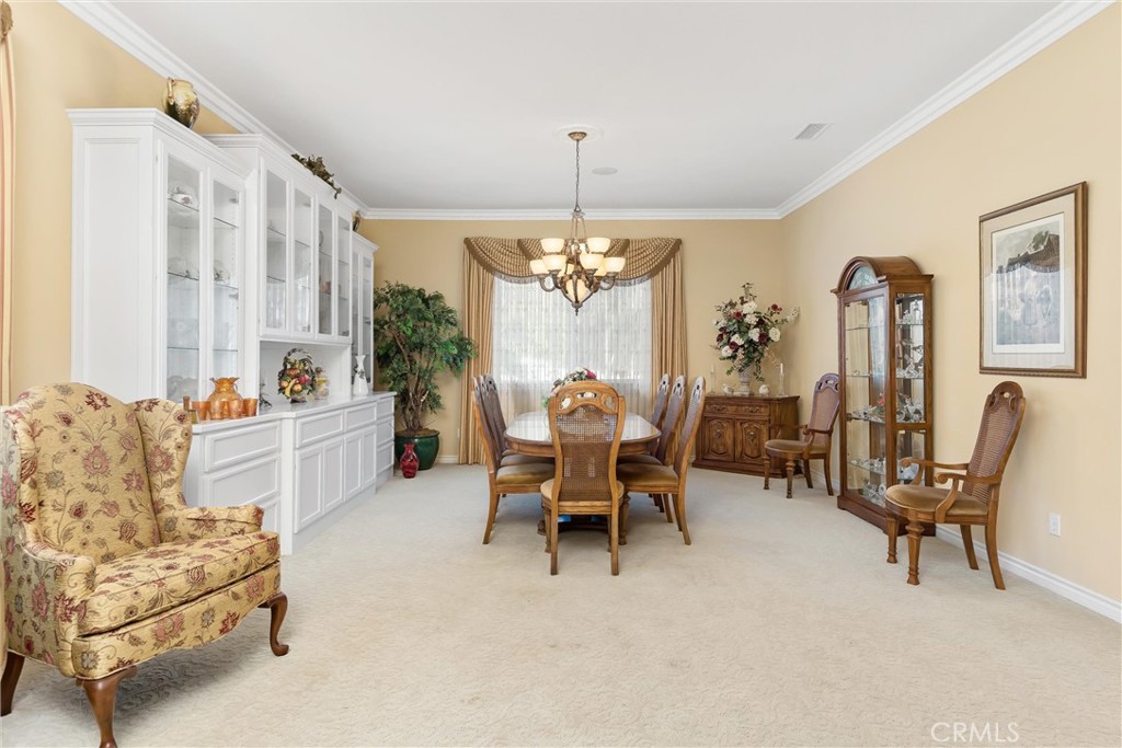 9841 Kehl Canyon Road Beaumont, CA 92223 - Photo 11 of 57 a living room with furniture and a chandelier
