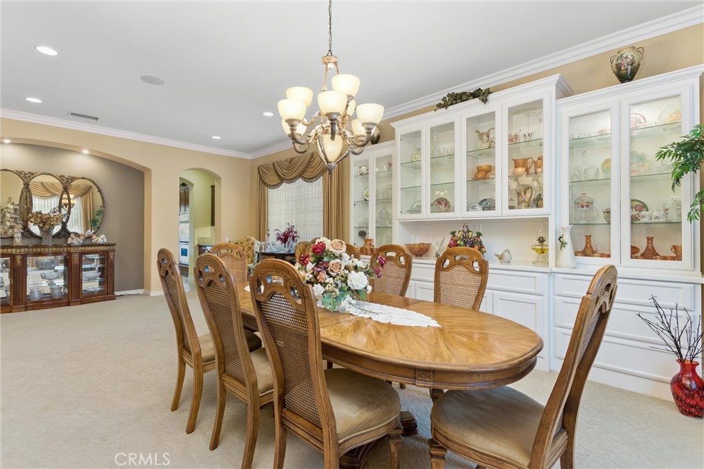 9841 Kehl Canyon Road Beaumont, CA 92223 - Photo 12 of 57 a view of a a dining room with furniture window and wooden floor