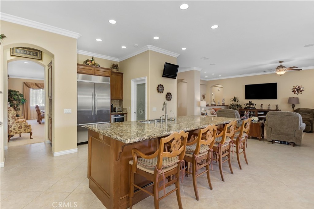 9841 Kehl Canyon Road Beaumont, CA 92223 - Photo 16 of 57 a large kitchen with a table and chairs