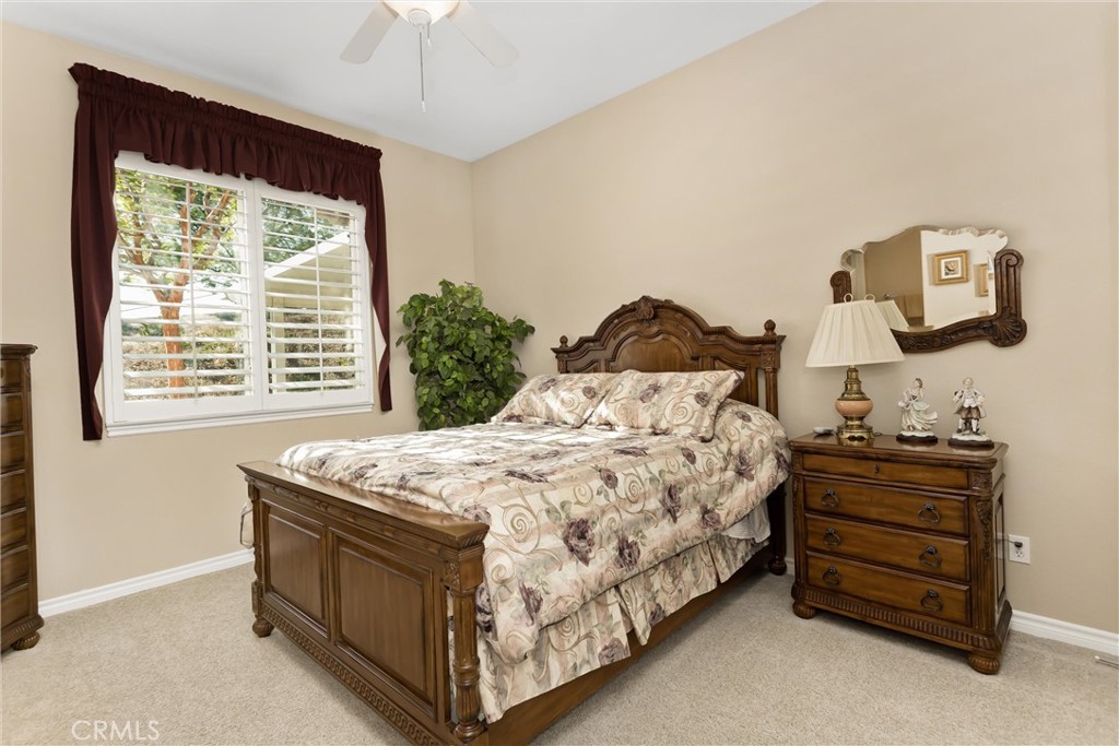 9841 Kehl Canyon Road Beaumont, CA 92223 - Photo 26 of 57 a bedroom with a bed and a window