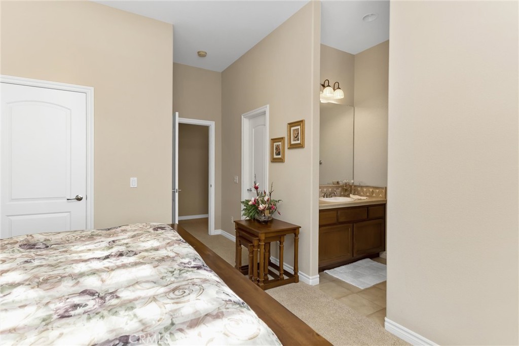 9841 Kehl Canyon Road Beaumont, CA 92223 - Photo 27 of 57 a bedroom with a bed and a dresser