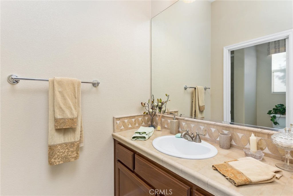 9841 Kehl Canyon Road Beaumont, CA 92223 - Photo 30 of 57 a bathroom with a sink and a mirror