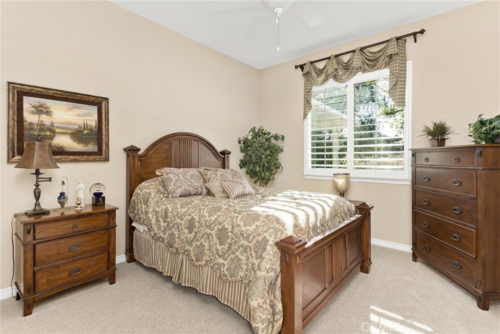 9841 Kehl Canyon Road Beaumont, CA 92223 - Photo 31 of 57 a bedroom with a bed and a window