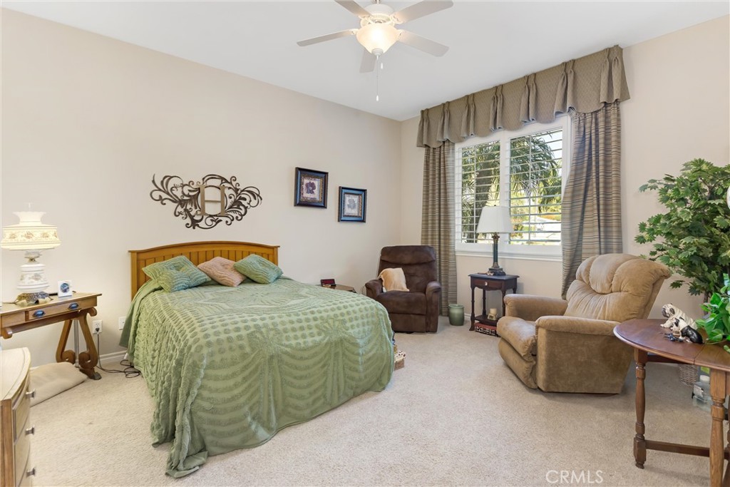 9841 Kehl Canyon Road Beaumont, CA 92223 - Photo 33 of 57 a bedroom with a bed and a couch