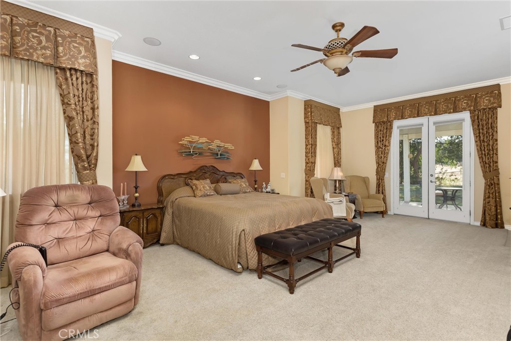 9841 Kehl Canyon Road Beaumont, CA 92223 - Photo 36 of 57 a spacious bedroom with a bed and a couch