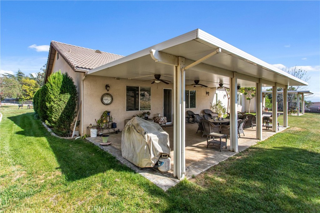 9841 Kehl Canyon Road Beaumont, CA 92223 - Photo 43 of 57 a view of a house with backyard porch and sitting area