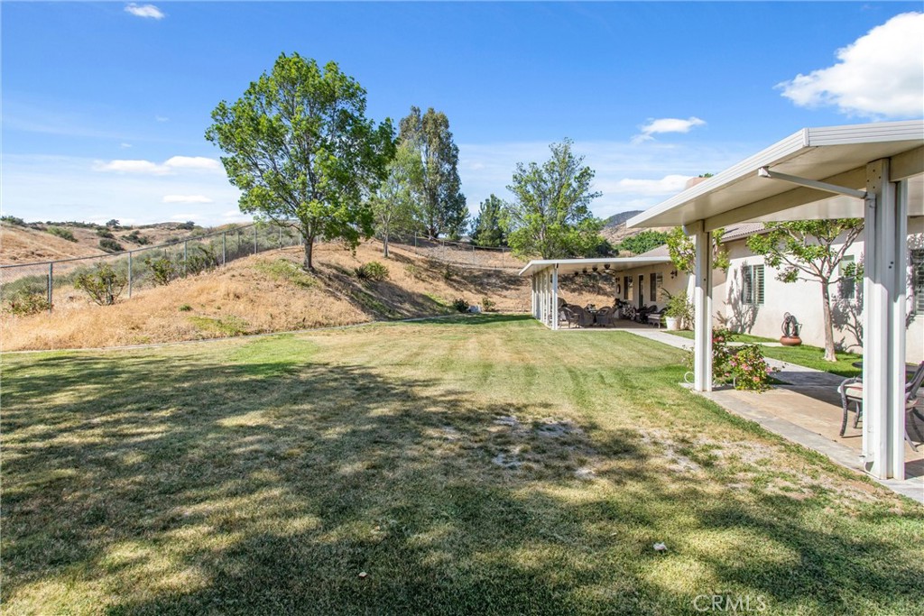 9841 Kehl Canyon Road Beaumont, CA 92223 - Photo 45 of 57 a view of a yard with an outdoor space