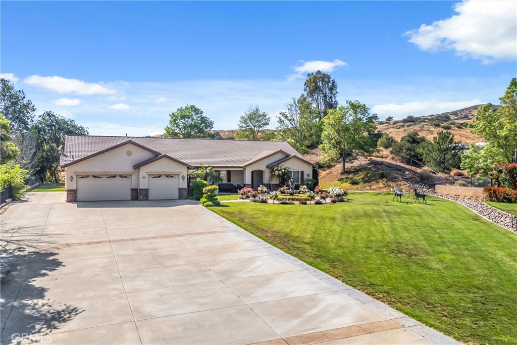 9841 Kehl Canyon Road Beaumont, CA 92223 - Photo 48 of 57 a front view of a house with a yard