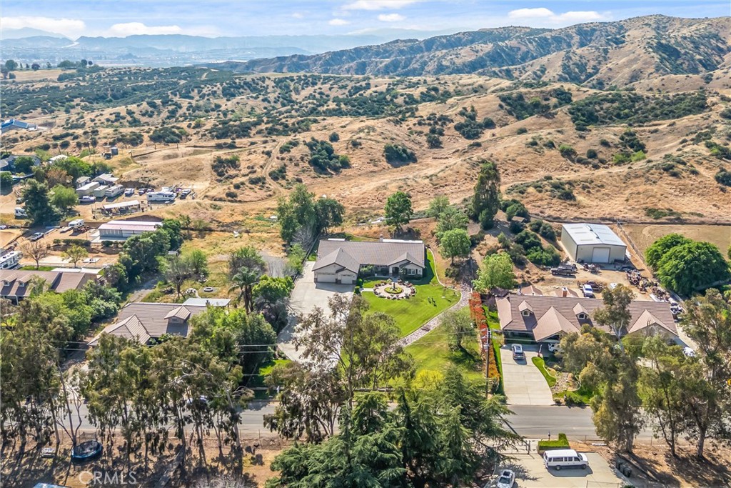9841 Kehl Canyon Road Beaumont, CA 92223 - Photo 50 of 57 an aerial view of residential houses with outdoor space
