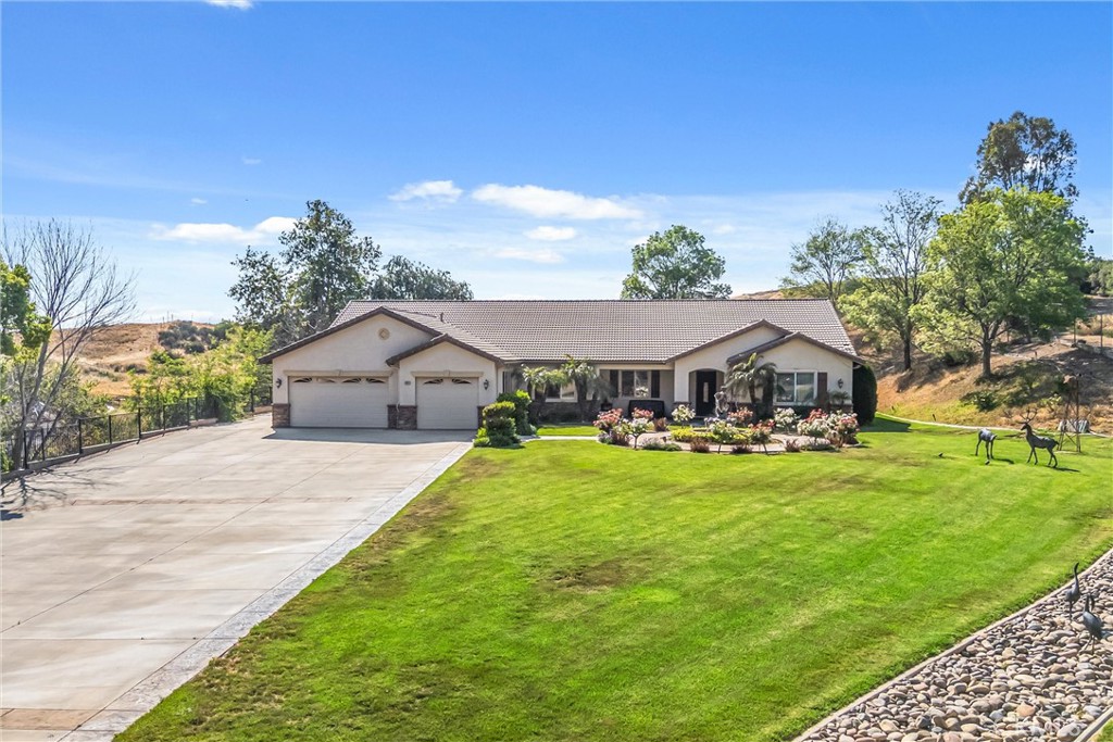 9841 Kehl Canyon Road Beaumont, CA 92223 - Photo 5 of 57 a front view of a house with garden