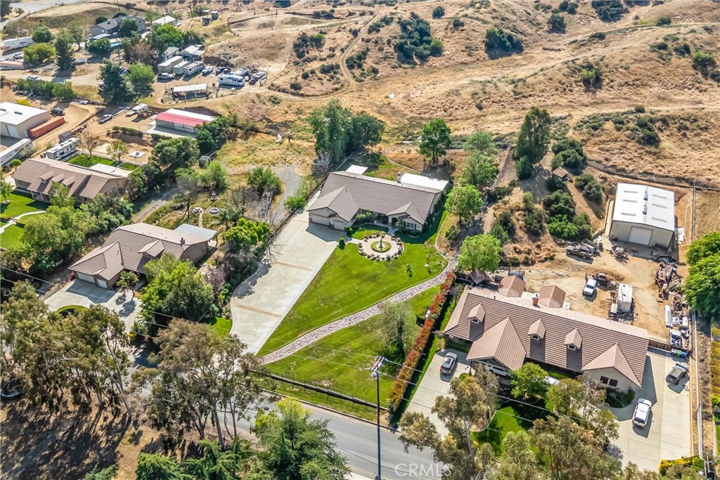 9841 Kehl Canyon Road Beaumont, CA 92223 - Photo 52 of 57 an aerial view of residential houses with outdoor space