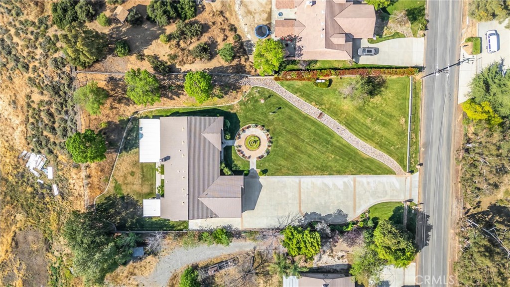 9841 Kehl Canyon Road Beaumont, CA 92223 - Photo 53 of 57 an aerial view of a house with a garden