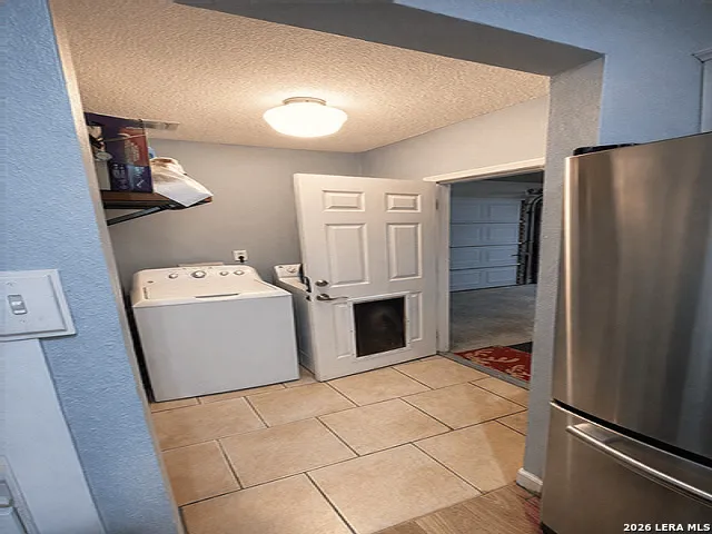 a utility room with washer and dryer