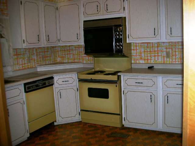 1 Rr Weldon, IL 61882 - Photo 4 of 4 a kitchen with granite countertop cabinets stainless steel appliances and wooden floor