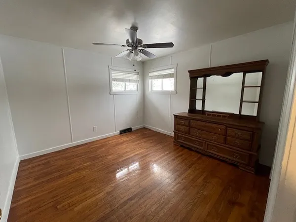 a view of room with window and hardwood floor