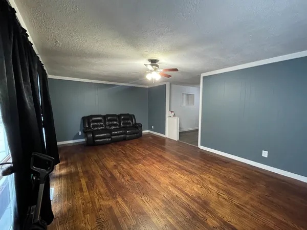 a view of empty room with a fireplace