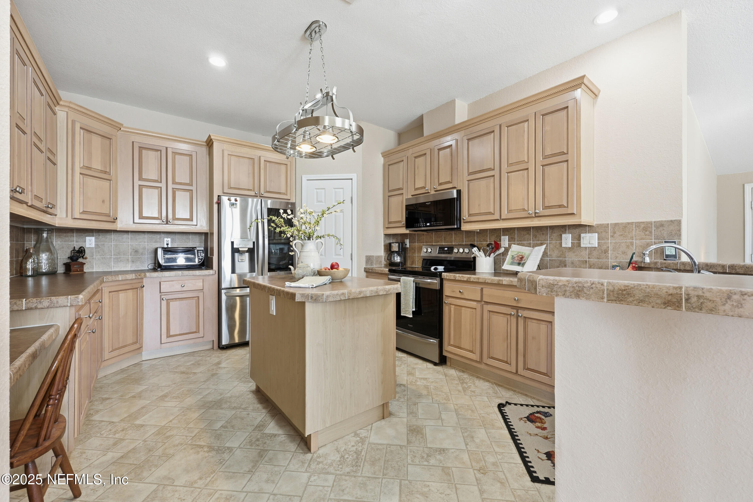 112 Waterside Avenue Satsuma, FL 32189 - Photo 13 of 52 a kitchen with sink cabinets and window