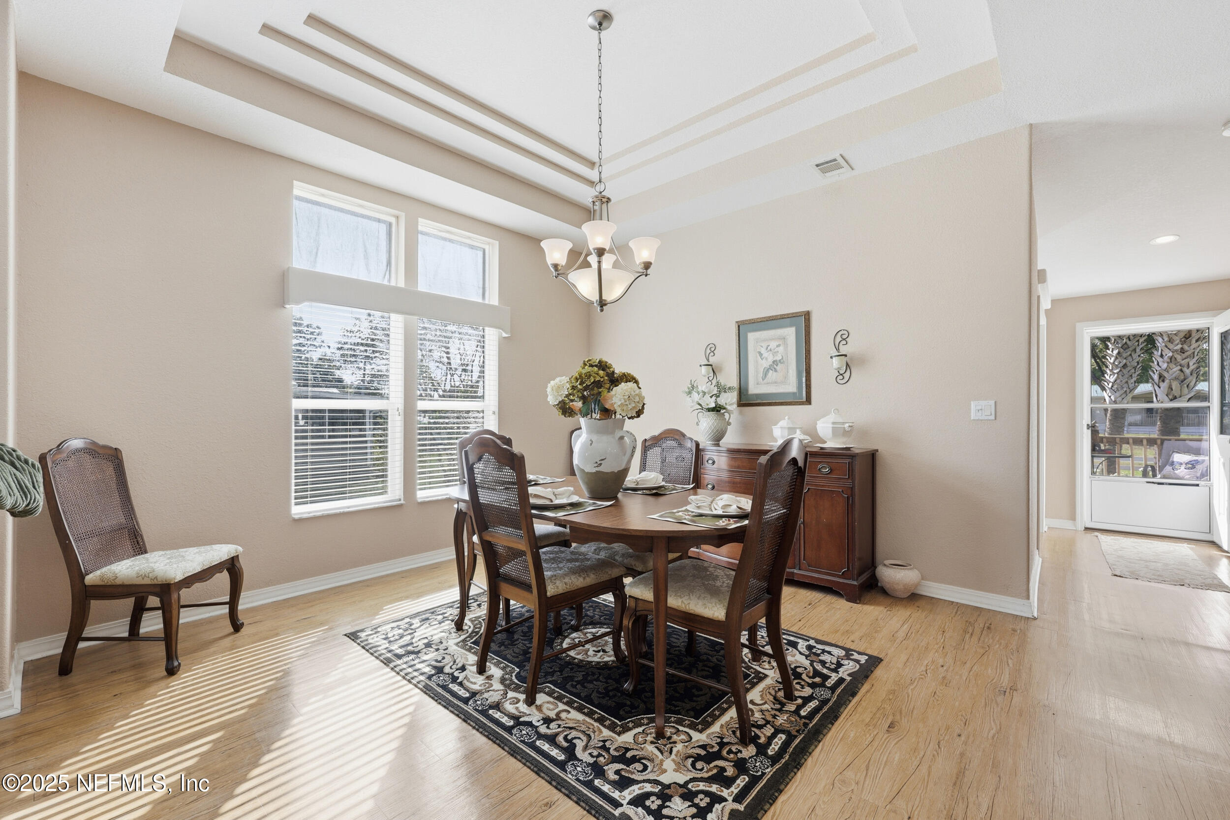 112 Waterside Avenue Satsuma, FL 32189 - Photo 20 of 52 a view of a dining room with furniture window and wooden floor