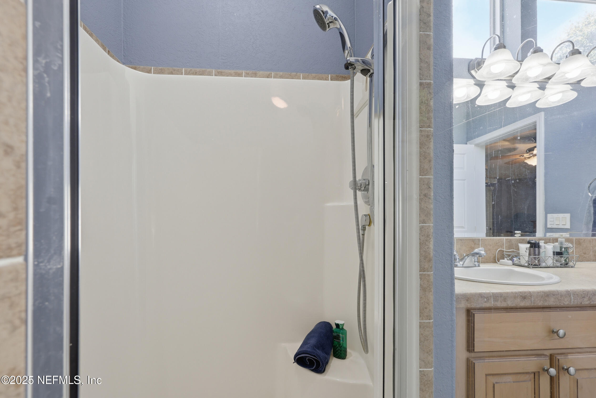 112 Waterside Avenue Satsuma, FL 32189 - Photo 24 of 52 a bathroom with a sink vanity and a mirror
