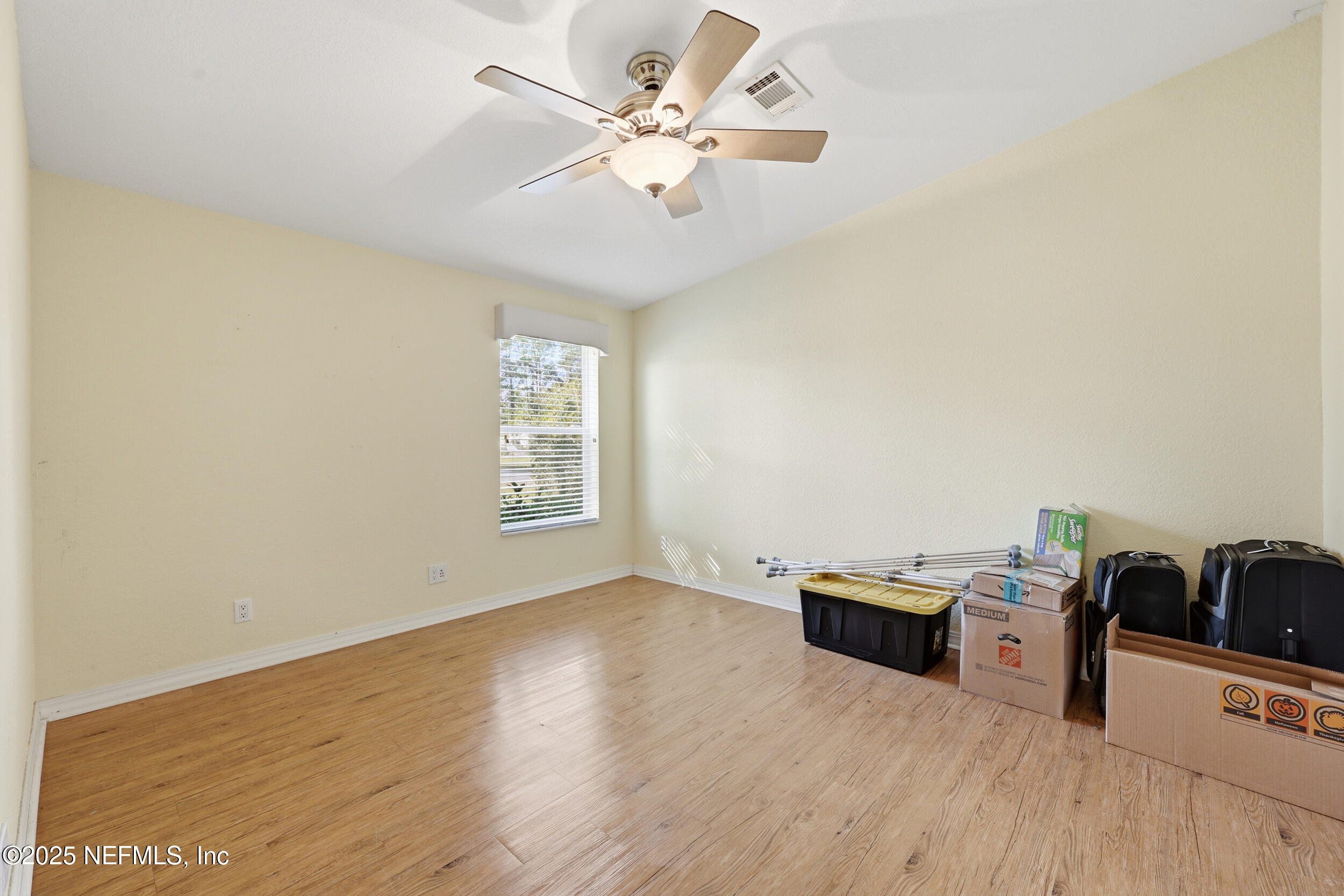 112 Waterside Avenue Satsuma, FL 32189 - Photo 26 of 52 a view of a room with wooden floor and ceiling fan