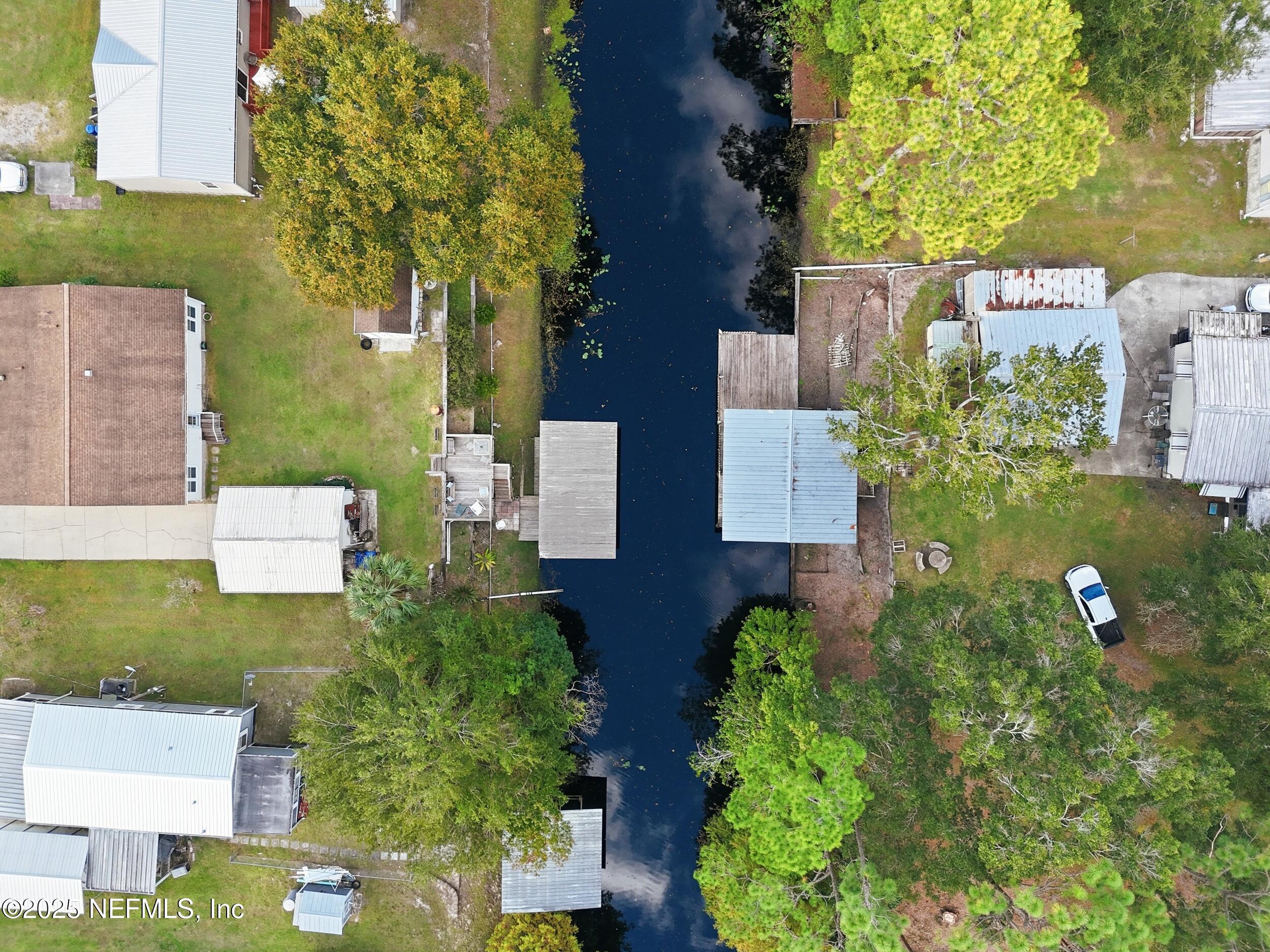 112 Waterside Avenue Satsuma, FL 32189 - Photo 38 of 52 an aerial view of residential house with outdoor space and trees all around
