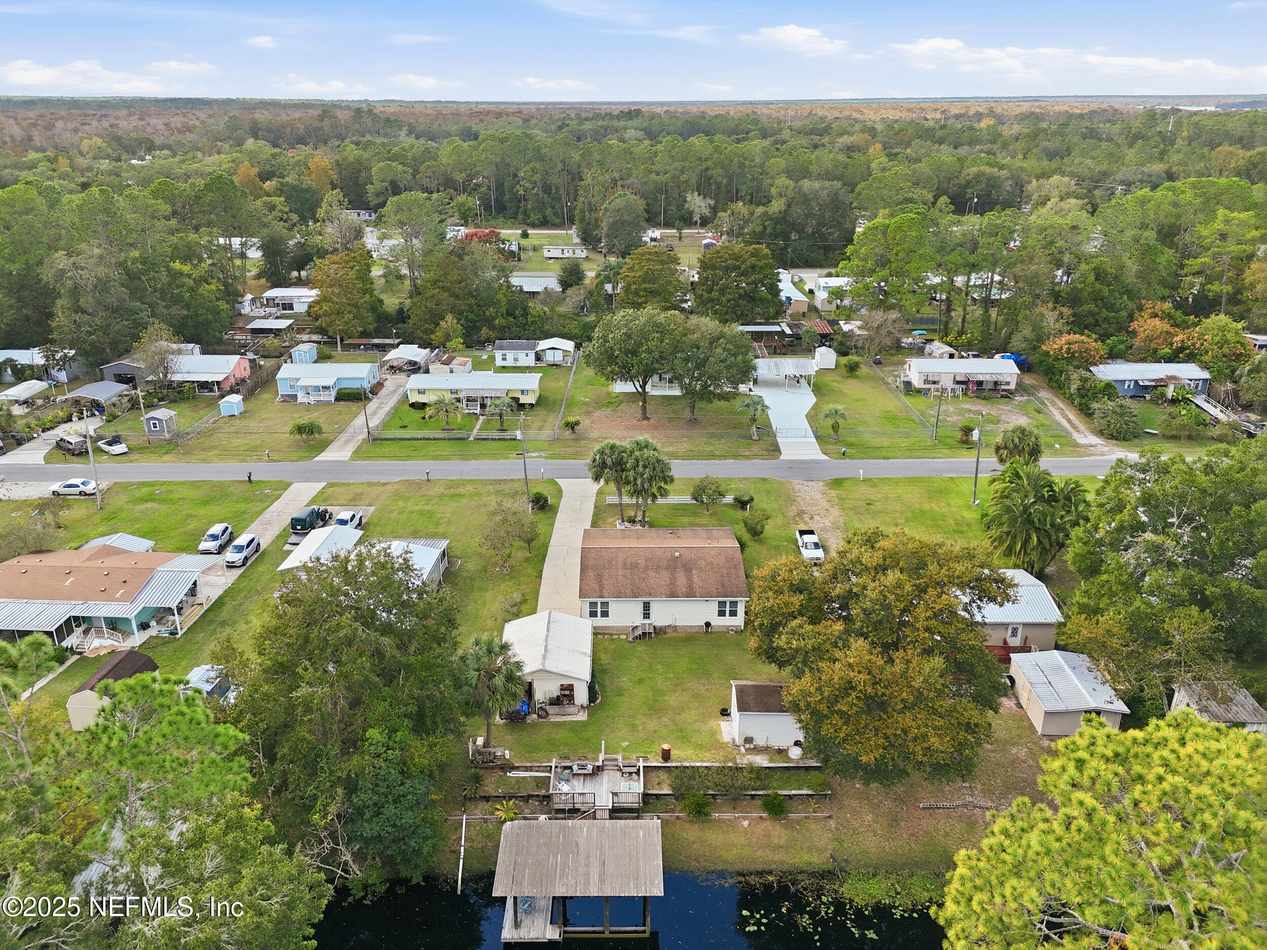 112 Waterside Avenue Satsuma, FL 32189 - Photo 41 of 52 an aerial view of residential houses with outdoor space and trees