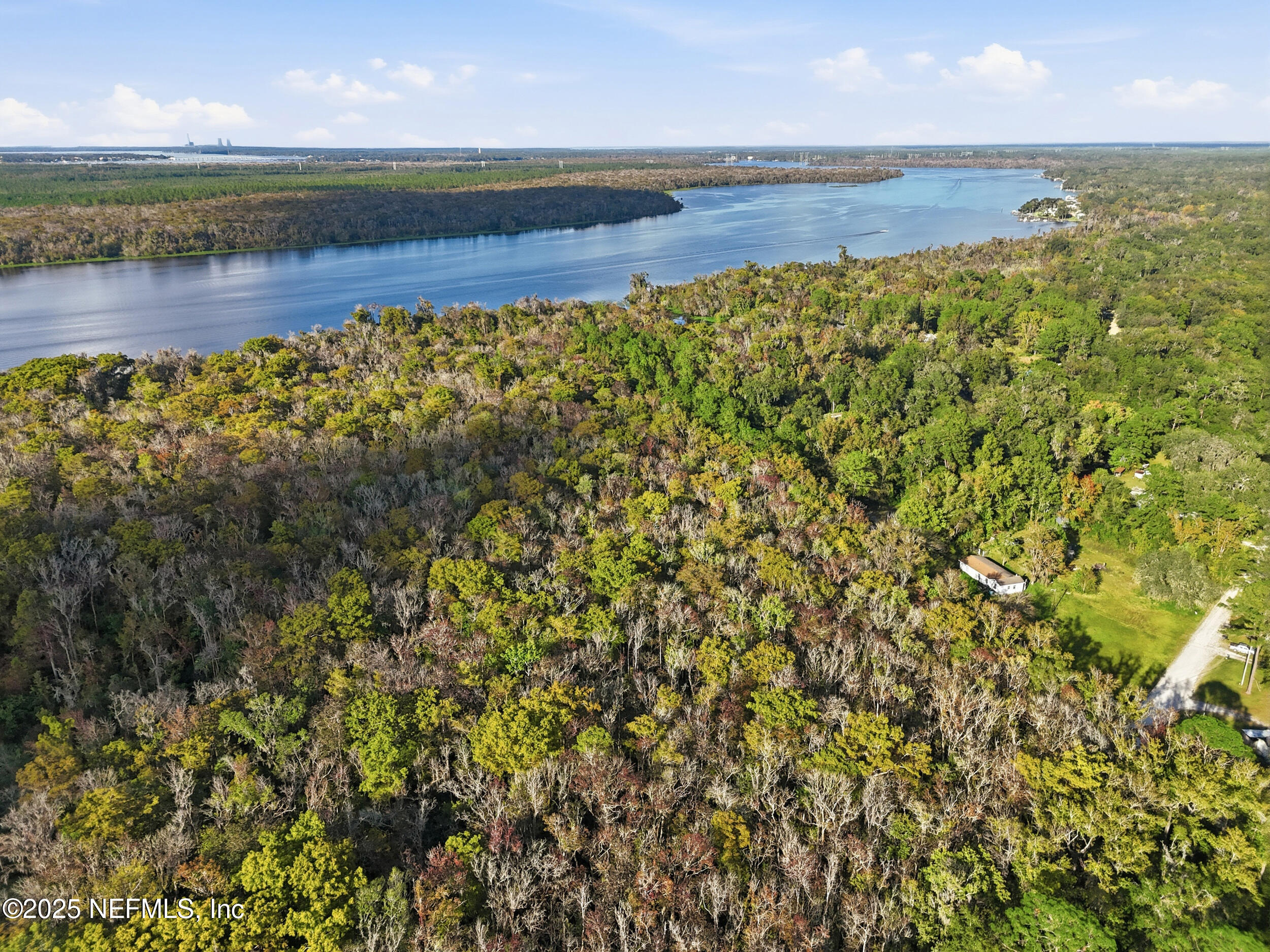 112 Waterside Avenue Satsuma, FL 32189 - Photo 7 of 52 a view of a lake with a big yard