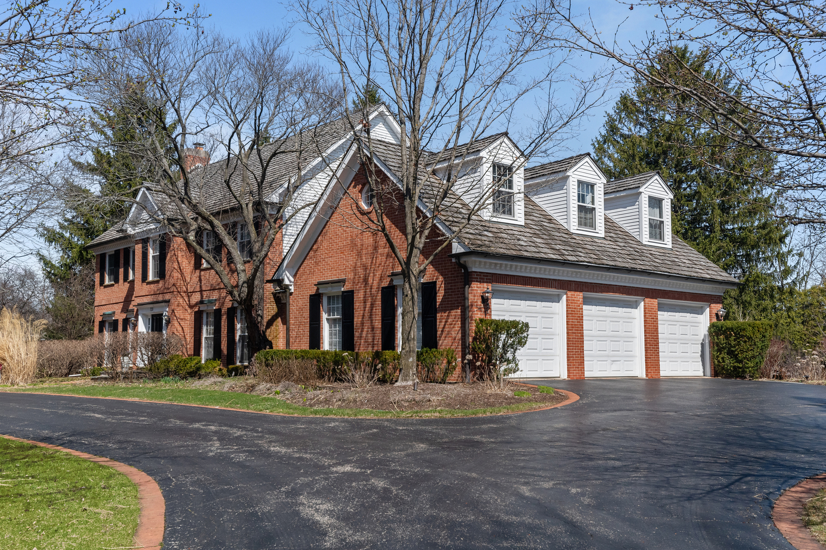 720 Newcastle Drive Lake Forest, IL 60045 - Photo 2 of 42 a front view of a house with a yard