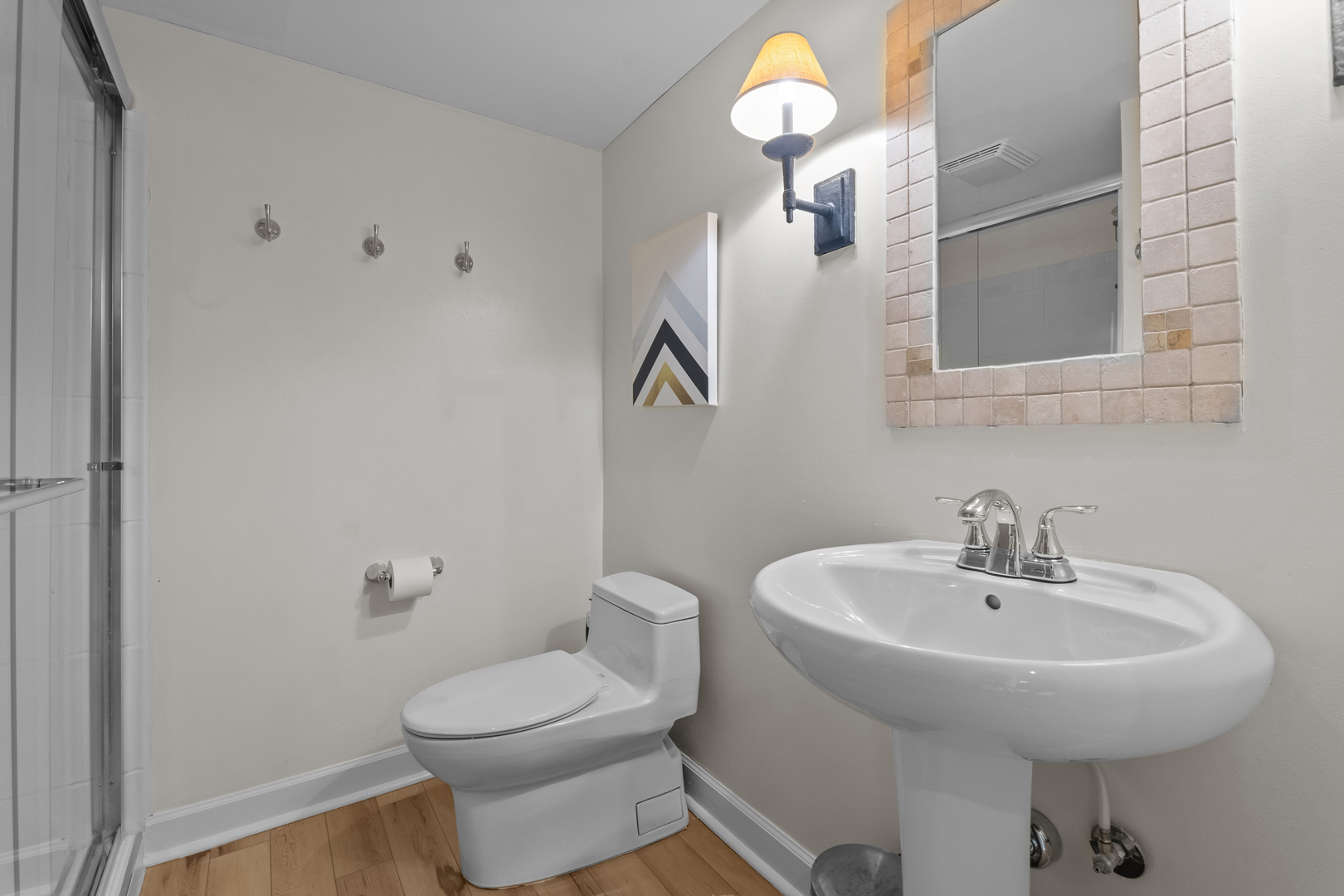 720 Newcastle Drive Lake Forest, IL 60045 - Photo 24 of 42 a bathroom with a toilet sink and mirror