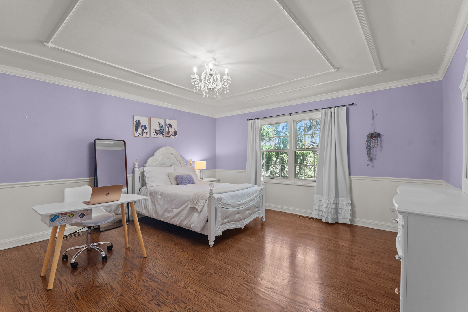 720 Newcastle Drive Lake Forest, IL 60045 - Photo 27 of 42 a bedroom with furniture and a chandelier