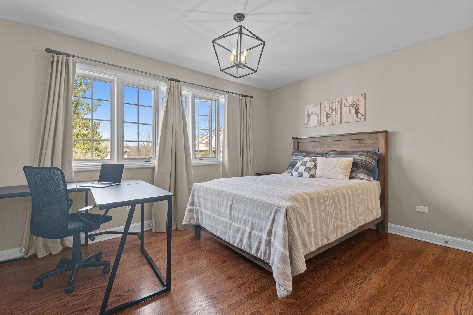 720 Newcastle Drive Lake Forest, IL 60045 - Photo 30 of 42 a bedroom with a bed a table and chair